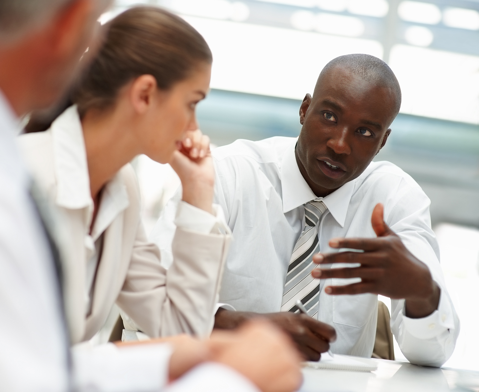 business people talking around a desk